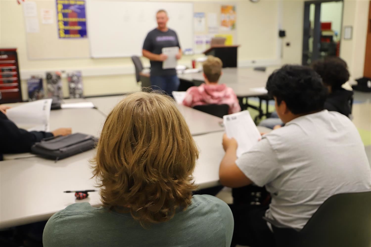 Students in CPI classroom listening to teacher.